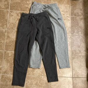 Two pairs of Puma Gray sweat pants. Size sm